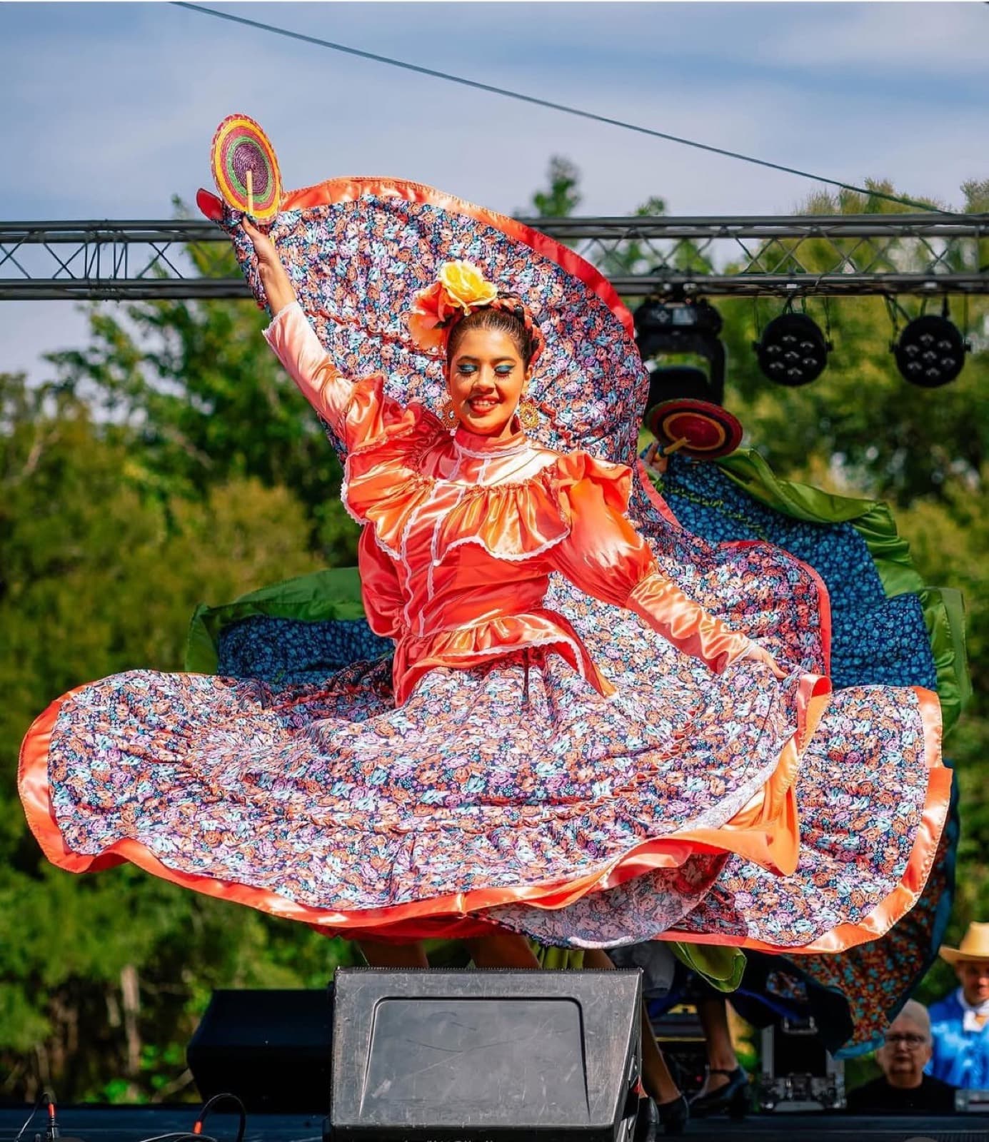 A dancer mid-twirl on the festival stage